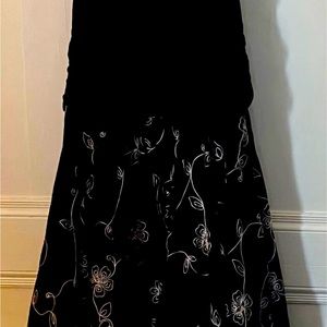 Black beautiful dress with white swirls on bottom of dress